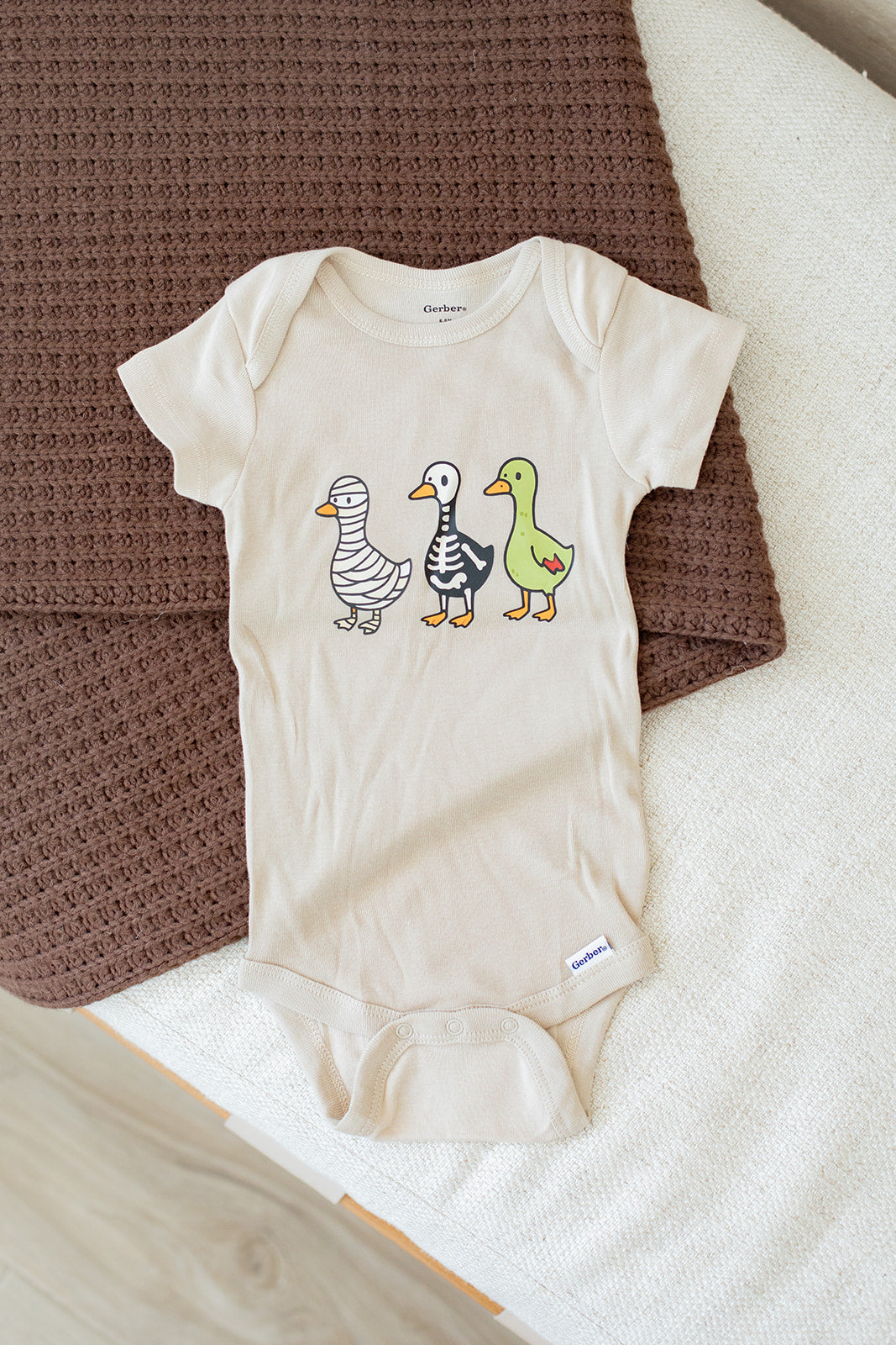 SPOOKY GOOSE BABY ONESIE
