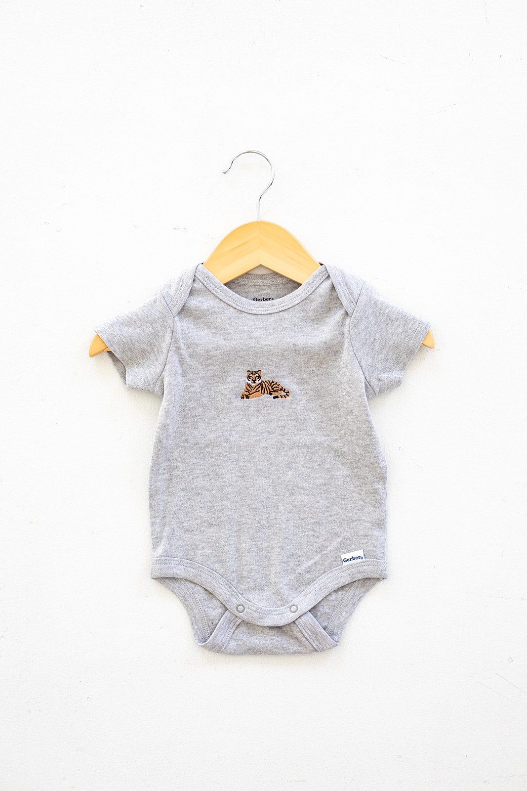 EMBROIDERED TIGER BABY BODYSUIT